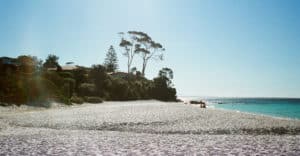 A sunflare irradiates one of the many whiter-than-white beaches which line the Jervis Bay coast, NSW