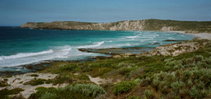 Sheer cliffs frame a windswept bay on Kangaroo Island in South Australia