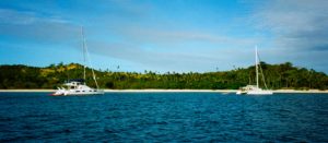 Catamarans anchored in a breathtaking bay, Yasawa Group, Fiji