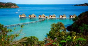 Over the overwater bungalows — a sumptuous view across Malolo Island, the Mamanucas, Fiji