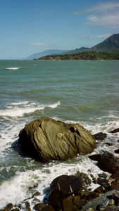 The coast of Far North Queensland is indented with jagged bays over which majestic mountain ranges loom